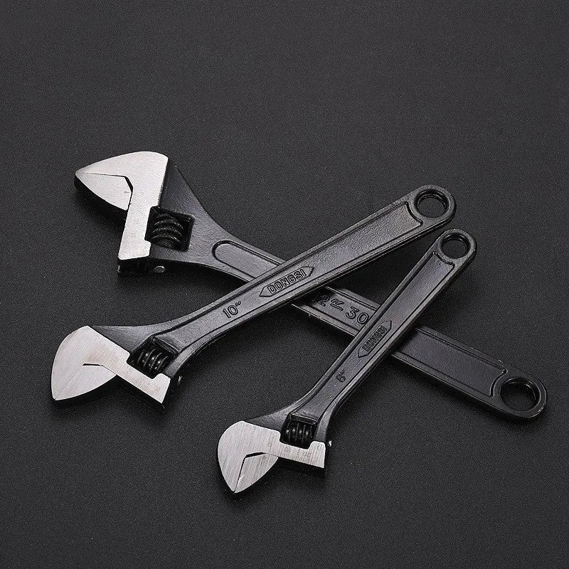 High carbon steel open-end adjustable wrench with black finish on a grey background.