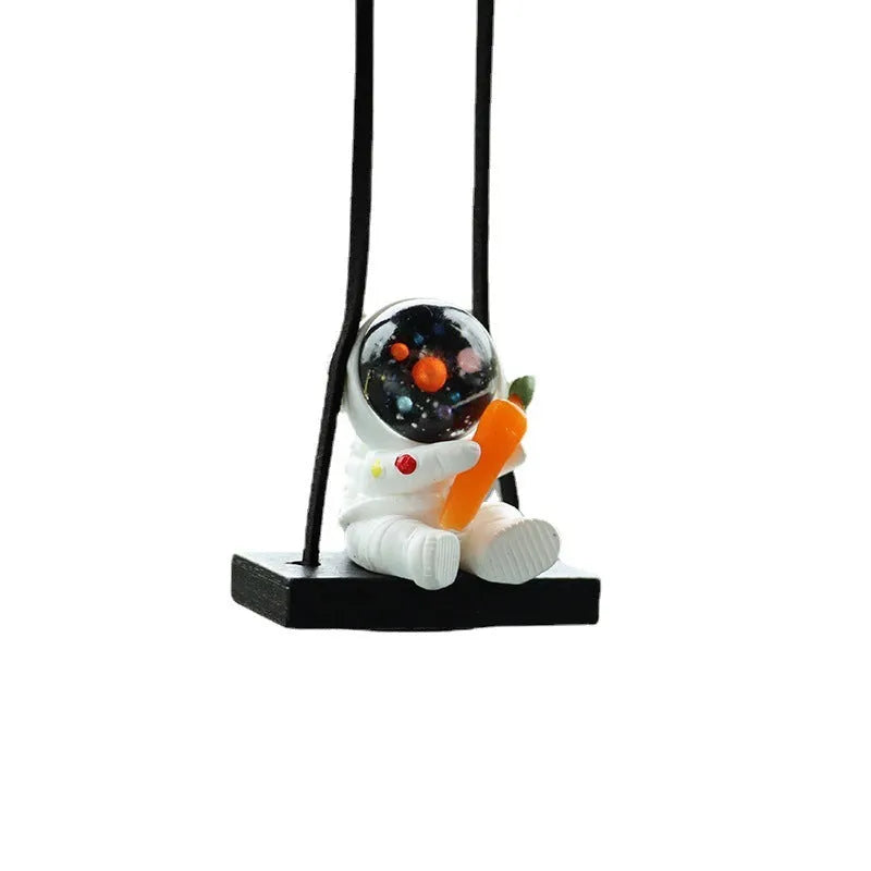Resin astronaut car pendant with cartoon space explorer designs including telescope and radish variations