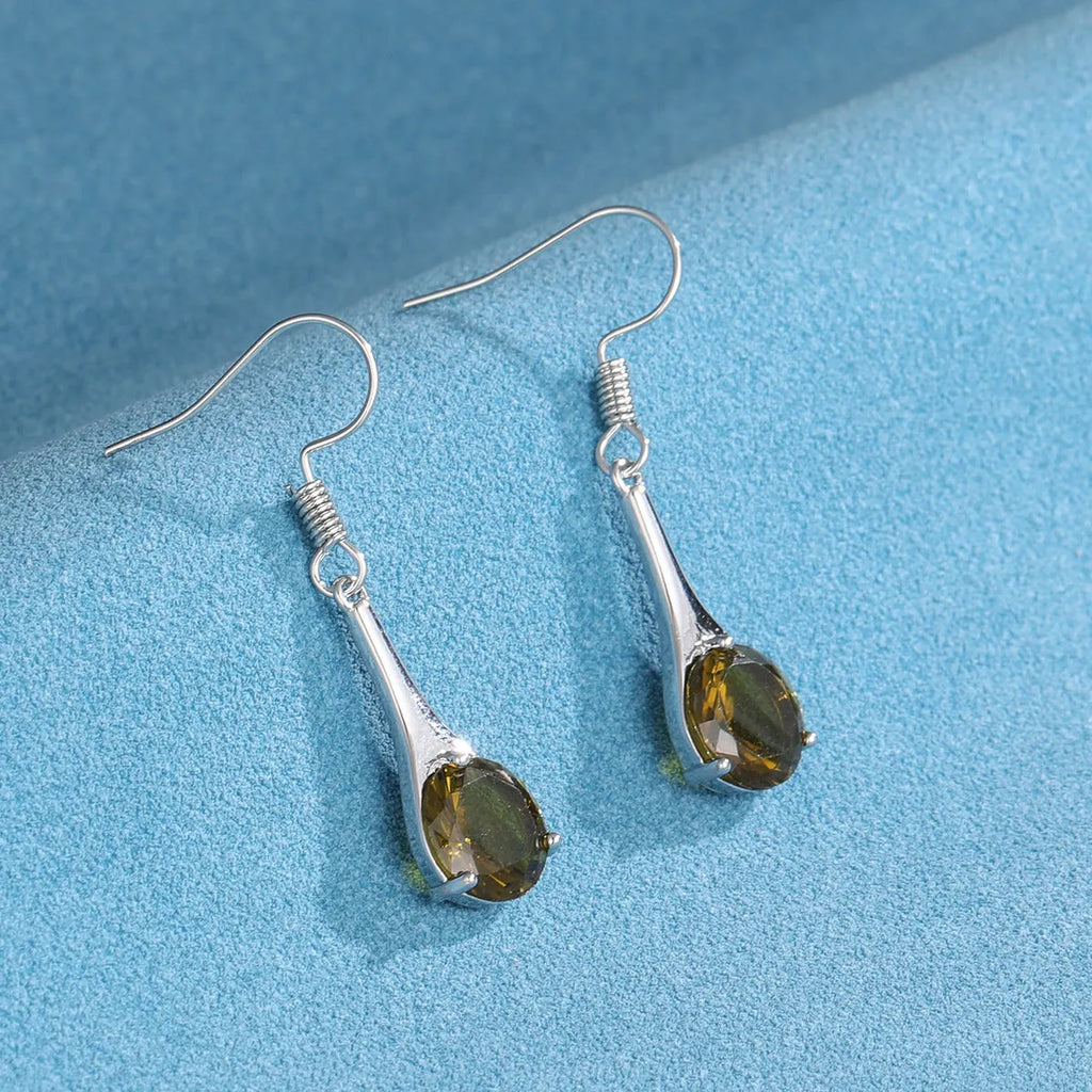 A pair of olive green retro-style drop earrings made from alloy on a white background.