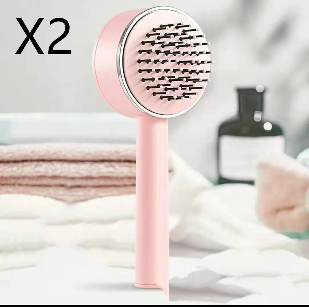 Plastic air cushion comb with long handle in white, green, and pink colours for hair detangling and styling