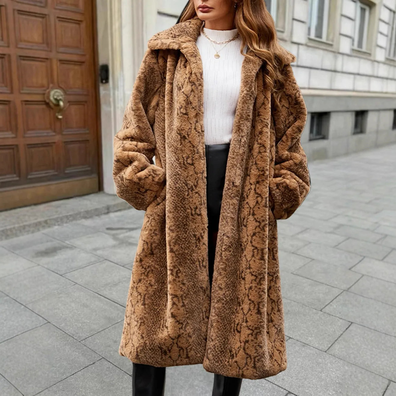 Women's long white leopard print faux fur coat with regular sleeves, shown in a front view.