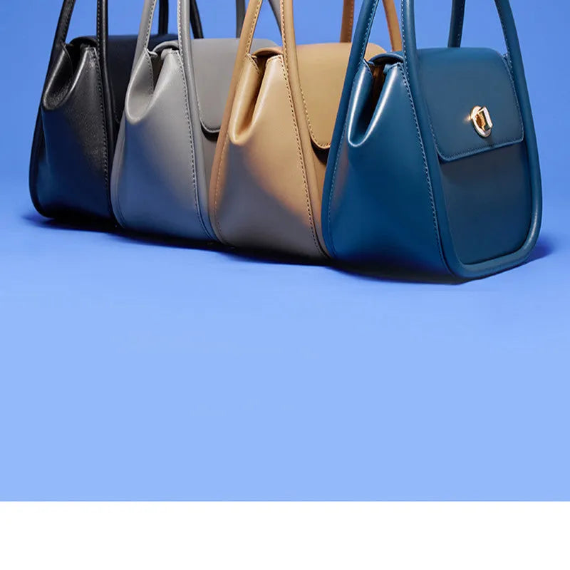 Genuine cow leather wing-shaped tote bag with buckle detail and cross-body shoulder strap