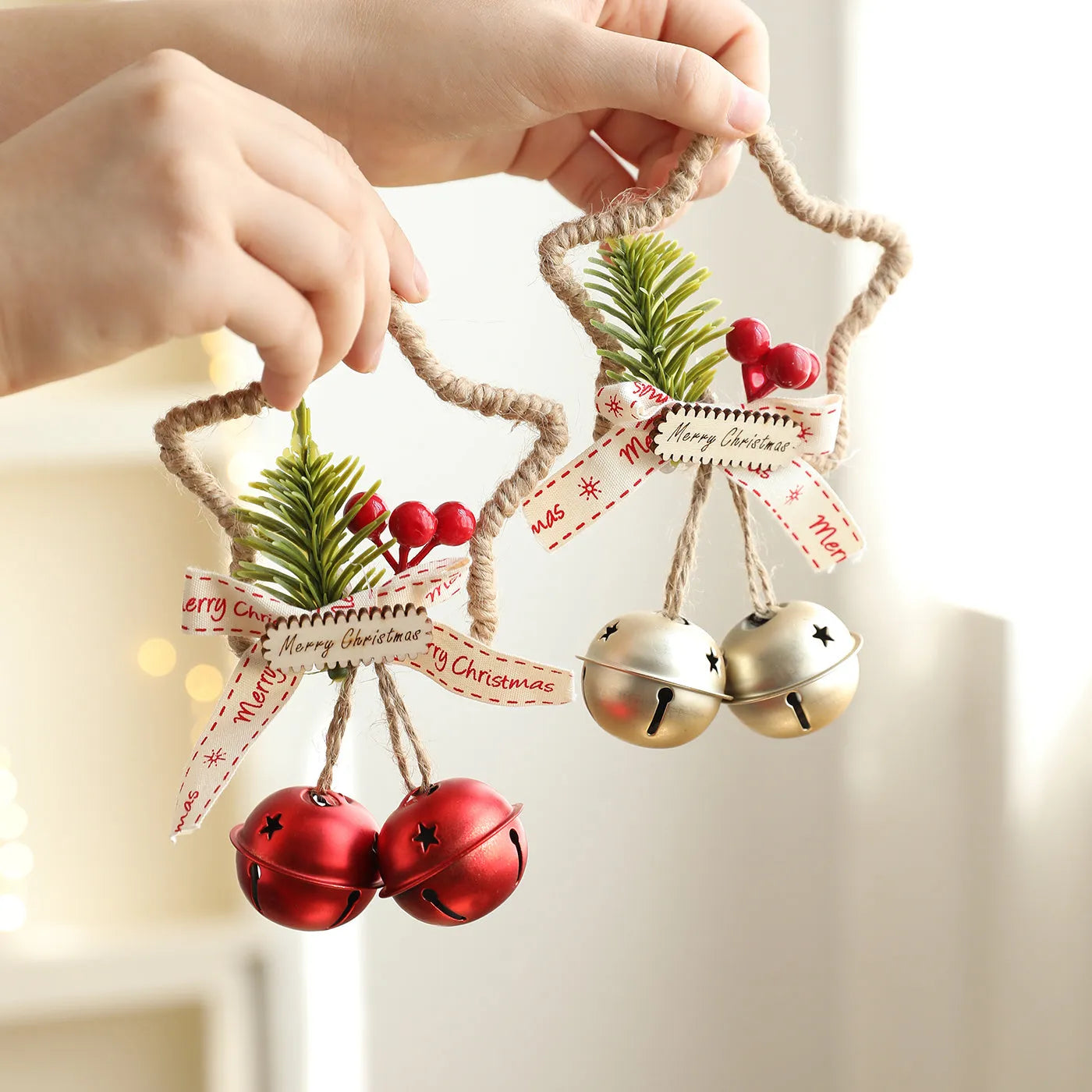 Iron Christmas bell ornament in gold on white background