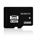 256MB TF memory card with packaging, shown next to compatible devices like an MP3 player and camera.