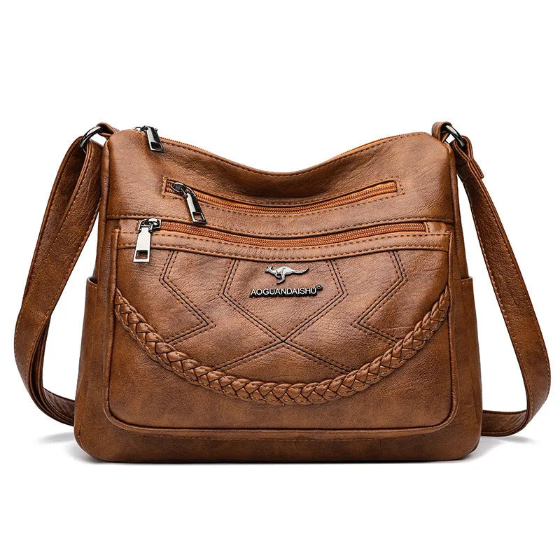 Soft PU leather women's crossbody shoulder bag in horizontal square shape with internal zipper compartments