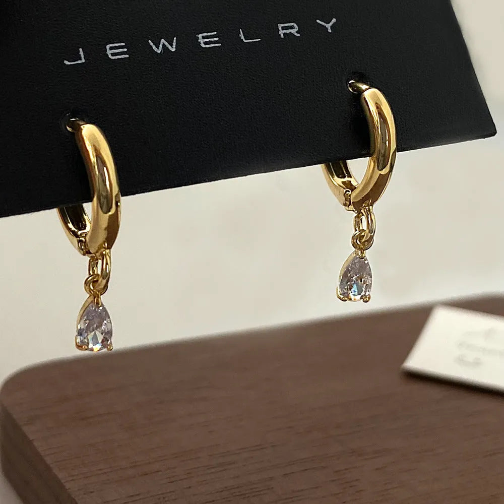 Zircon jewellery set with meteor shower geometric pendant necklace, matching earrings, and anklet