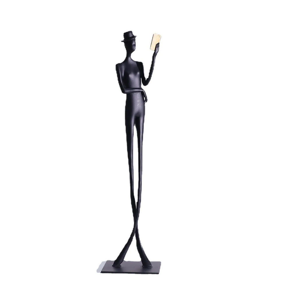 Black aluminium desktop sculpture of woman reading in modern style