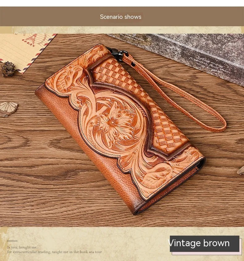 Women's brown leather tri-fold wallet with embossed Chinese floral pattern showing interior compartments
