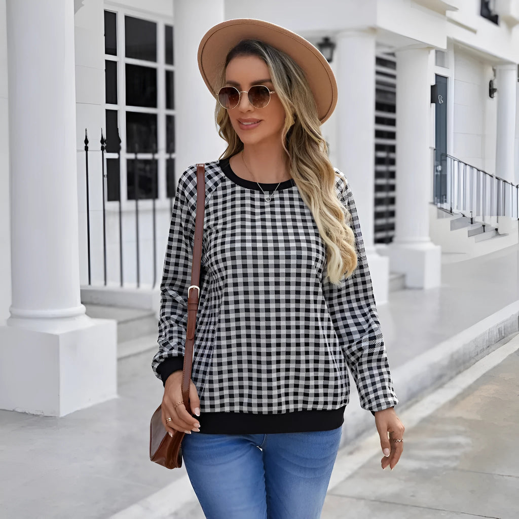 Black long sleeve pullover sweater with a printed Japanese plaid pattern