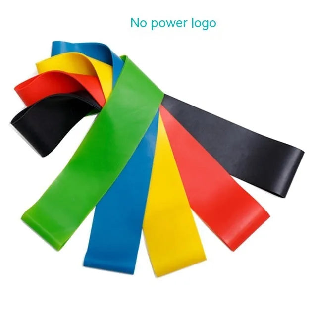Set of five coloured TPE yoga tension straps for fitness training laid flat showing green, blue, yellow, red, and black.