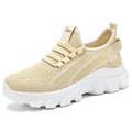Women's white Flyknit lace-up sneakers with a thick PVC sole and round toe on a neutral background