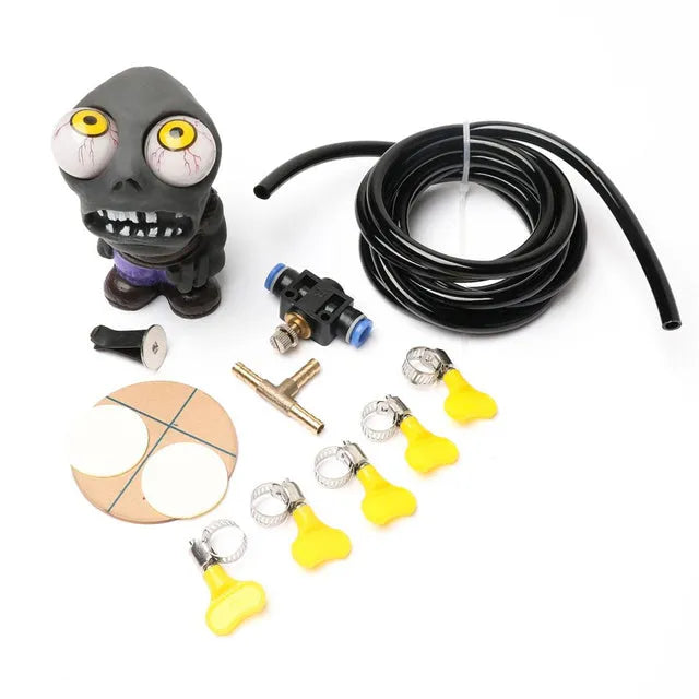 Turbo car blow-off valve ornament kit showing rubber doll, pressure valve, copper connectors and tubing