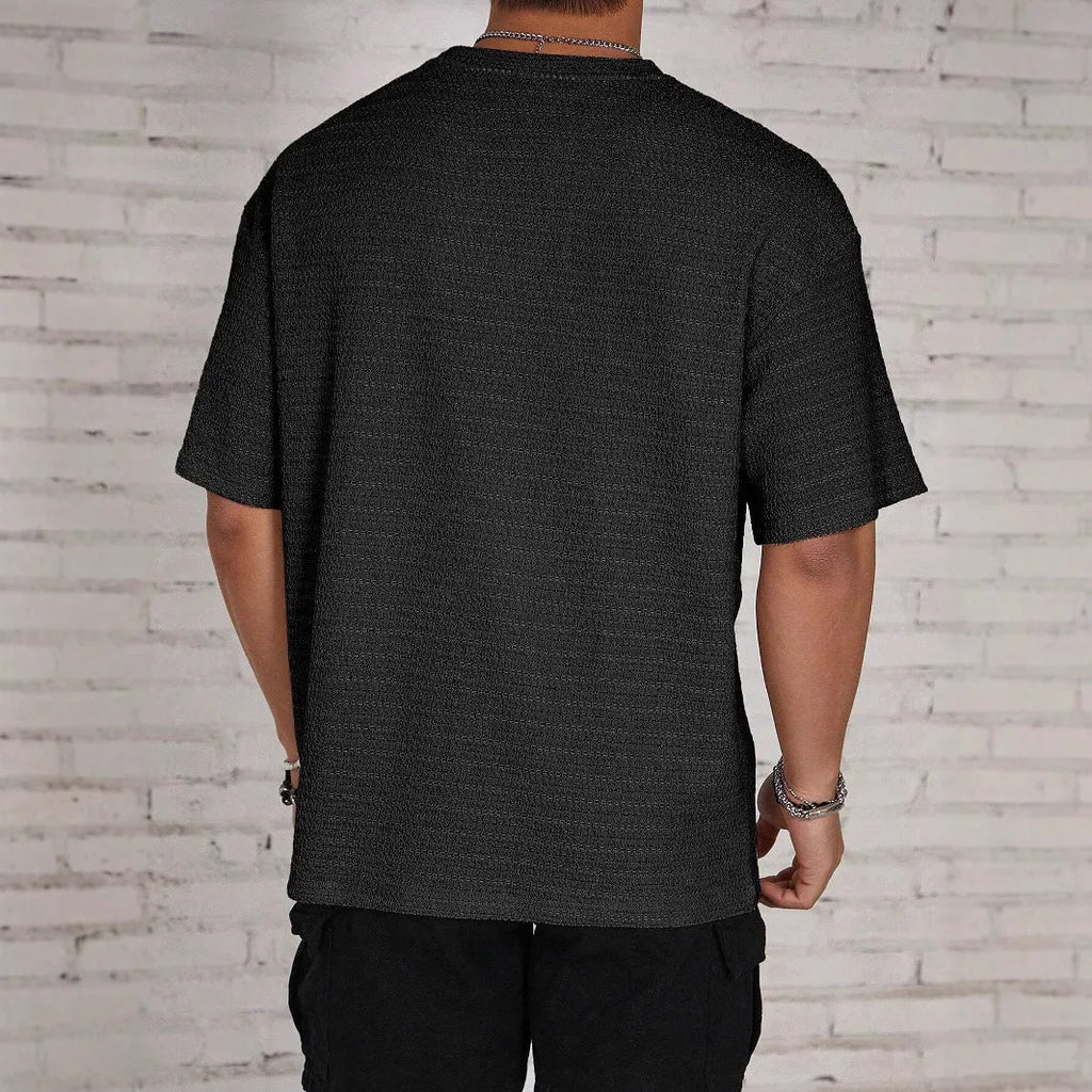 Men's slim fit solid colour polyester t-shirt in black, white, light blue, or khaki options