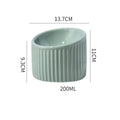 Round ceramic elevated cat bowl in green colour on a table