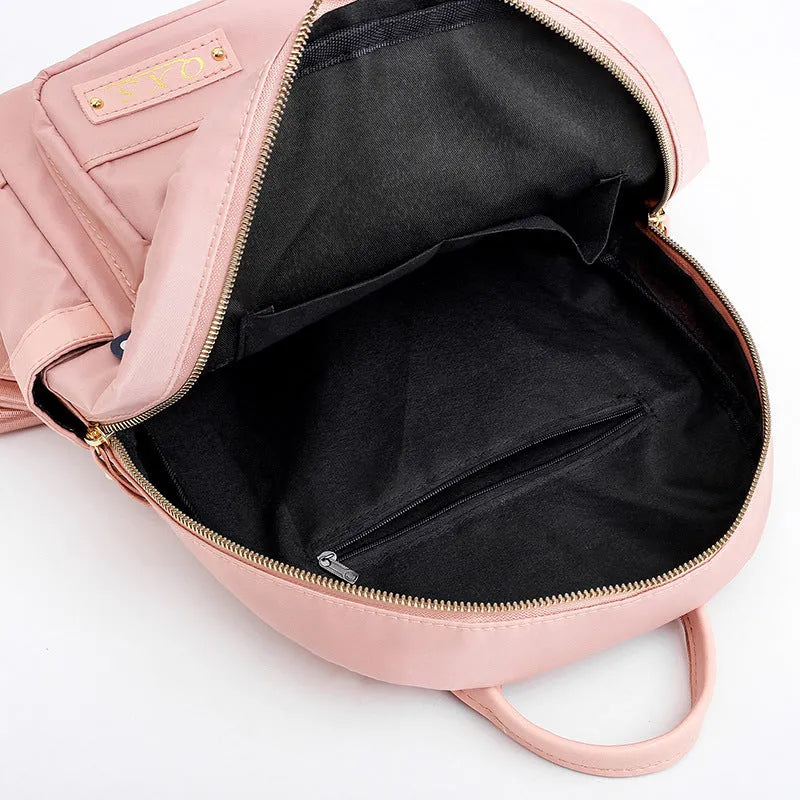 Women's soft nylon casual backpack in black colour with double shoulder straps and external pockets