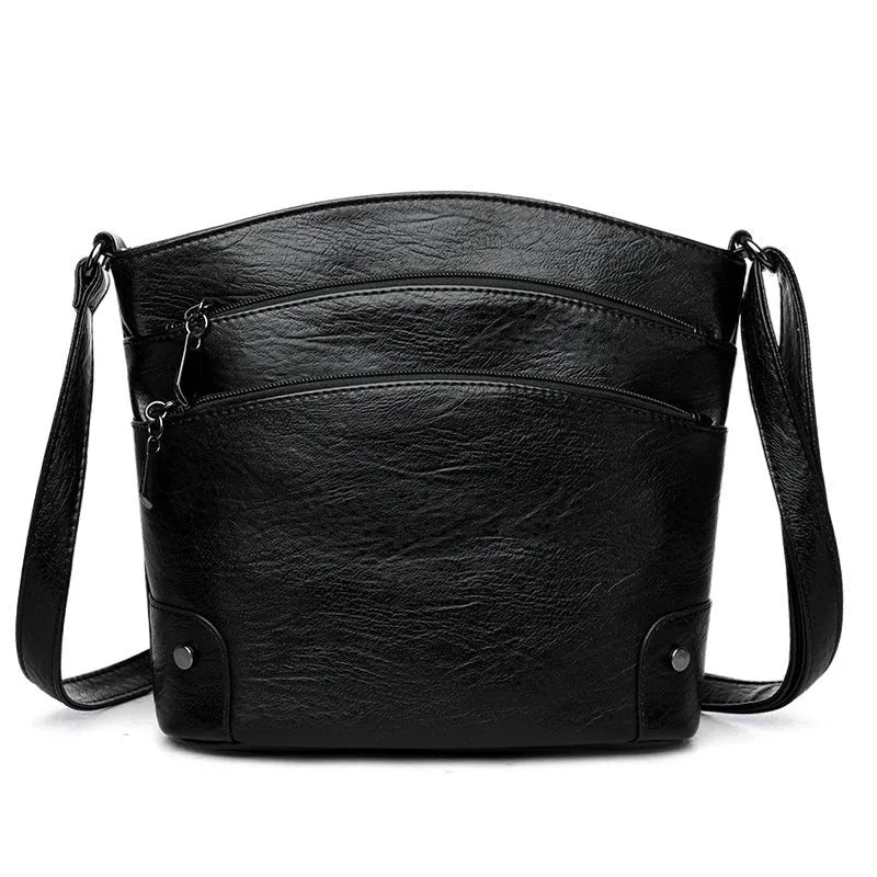 Large capacity multi-layer bucket bag in available colours including black, brown, and green
