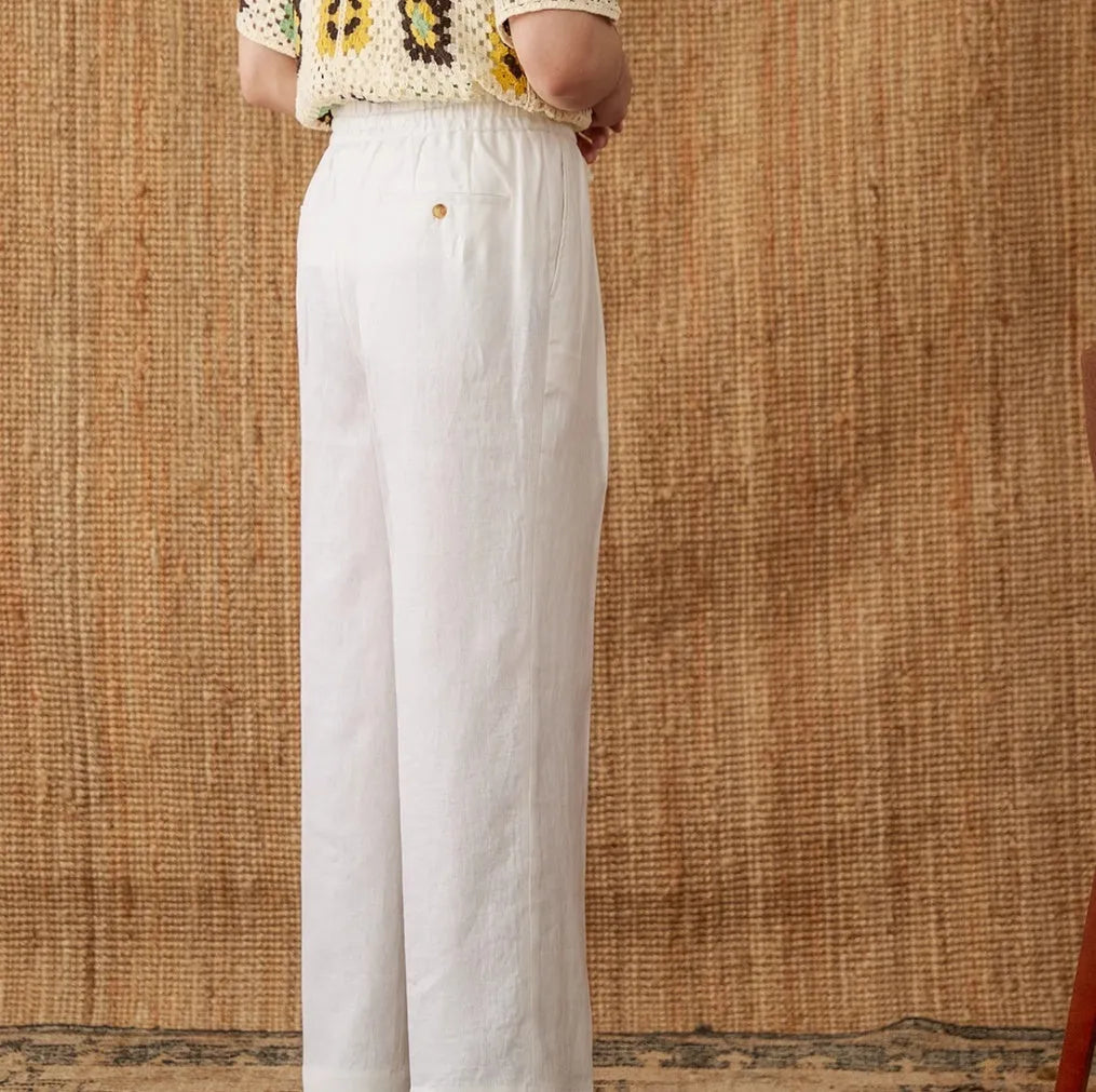 Women's high-waist linen trousers in greige colour with a straight-leg cut and elasticated waistband.