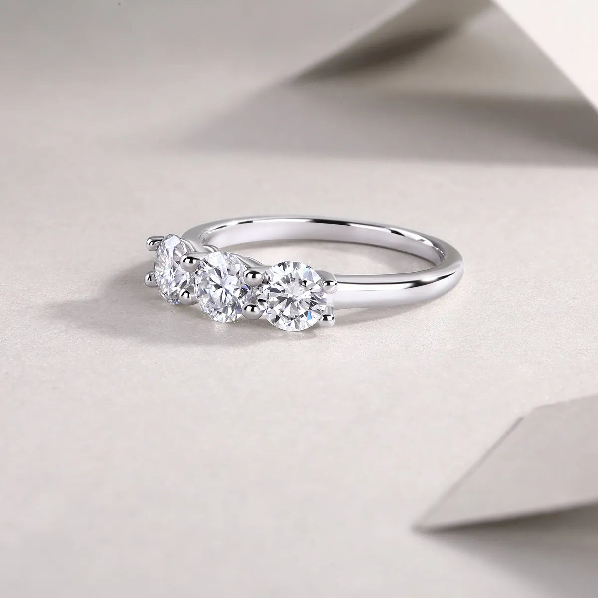 0.5 carat moissanite wedding ring set in S925 silver with platinum plating, gold colour, on white background