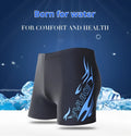 Men's plus size boxer swimming trunks with fire pattern and matching swimming cap.