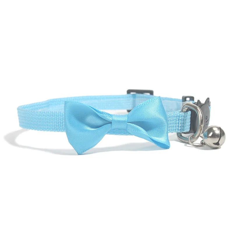 Adjustable nylon cat bow collar with a bell in a striped pattern, shown in a bright colour.