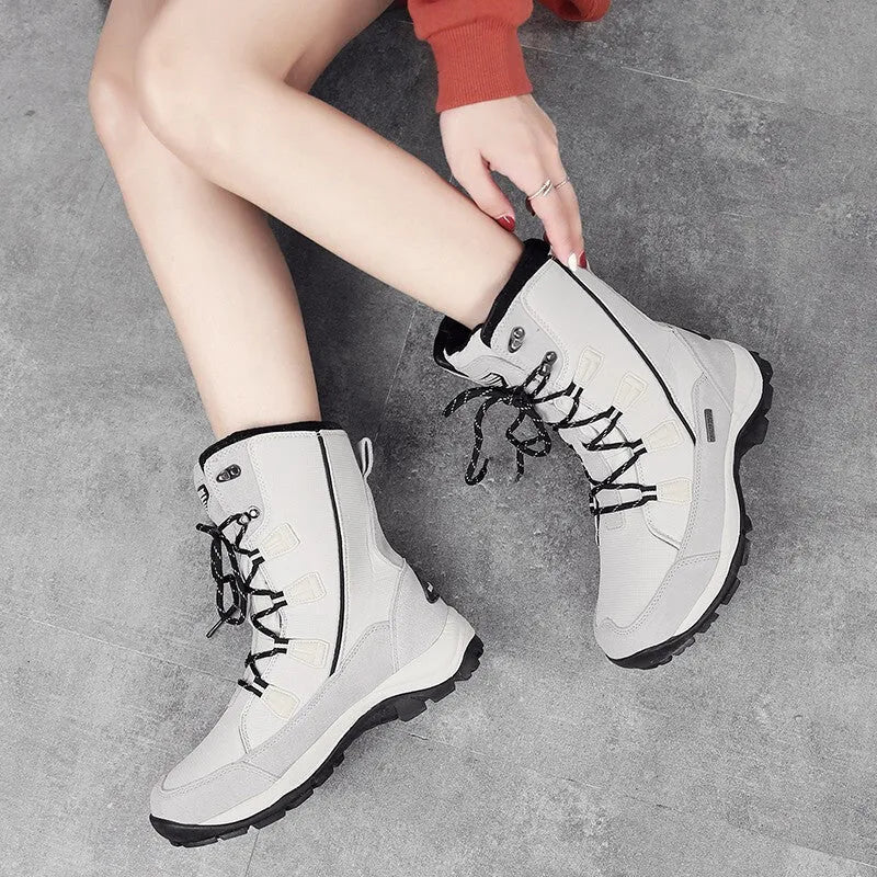 Women's mid-calf thermal snow boots in black with round toe and genuine leather upper