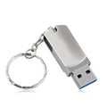 Small white metal USB flash drive with a swivelling silver cap showing connector.
