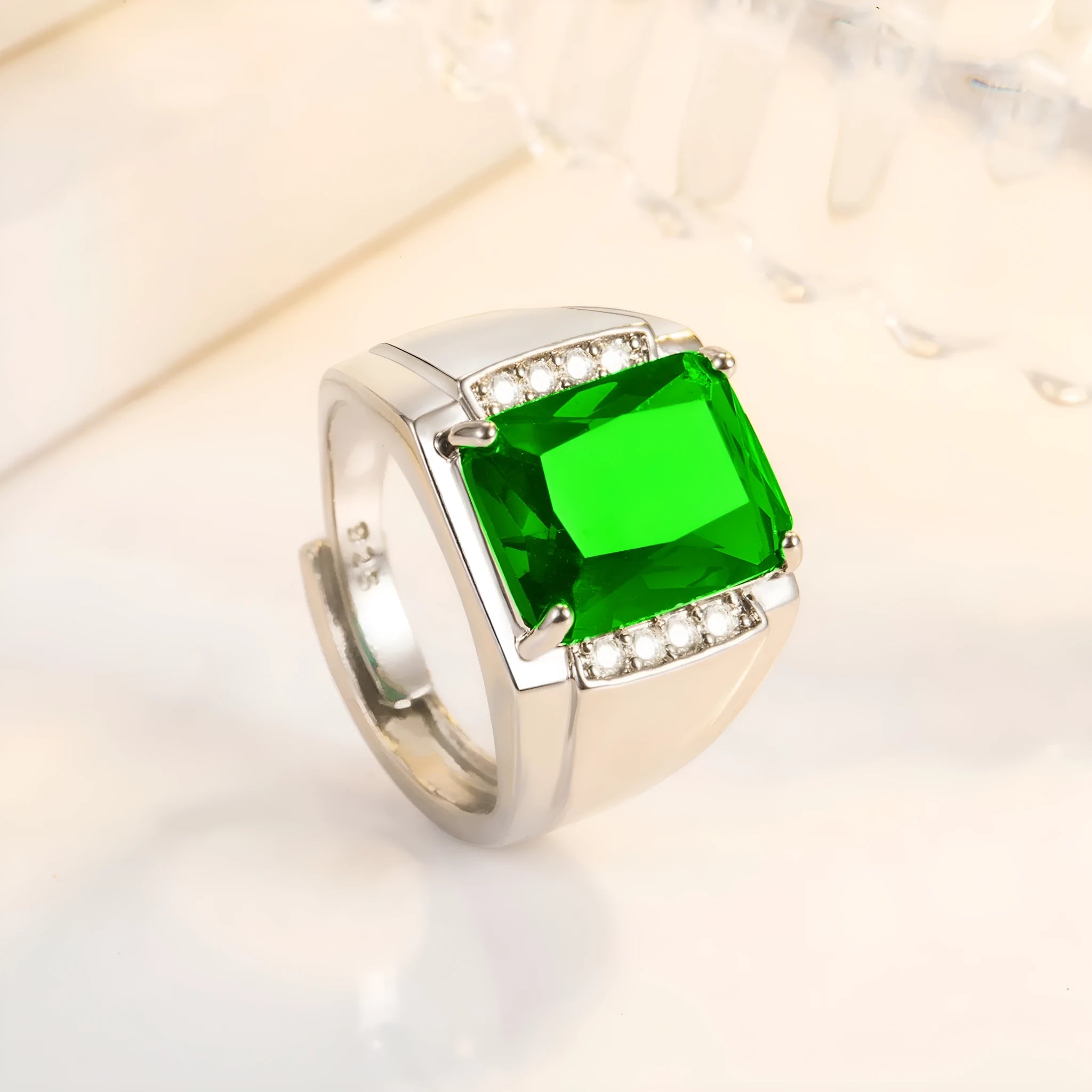Adjustable open geometric ring with coloured rhinestone setting on copper band.