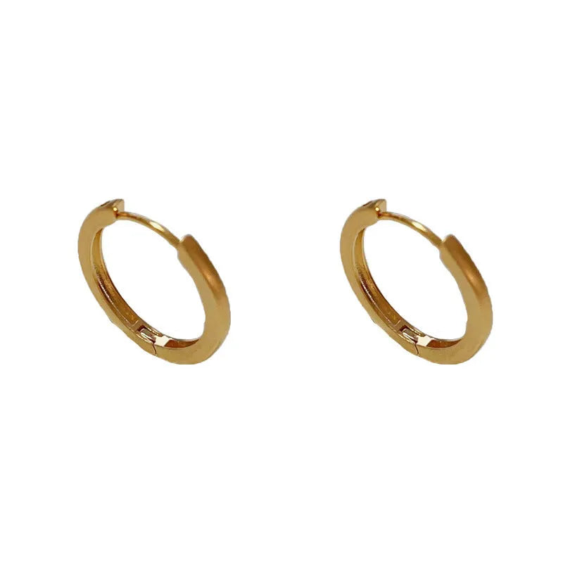 Geometric round eyelet ear clip jewellery in gold colour with real gold plating on copper material