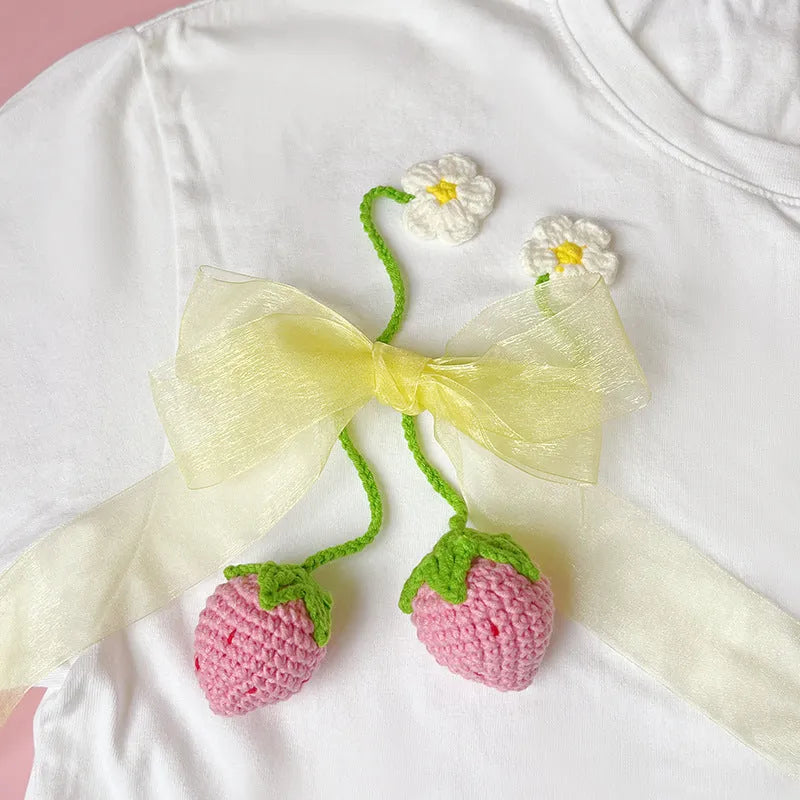 Handmade wool crochet strawberry pendant on 35cm cord in pink or red colour