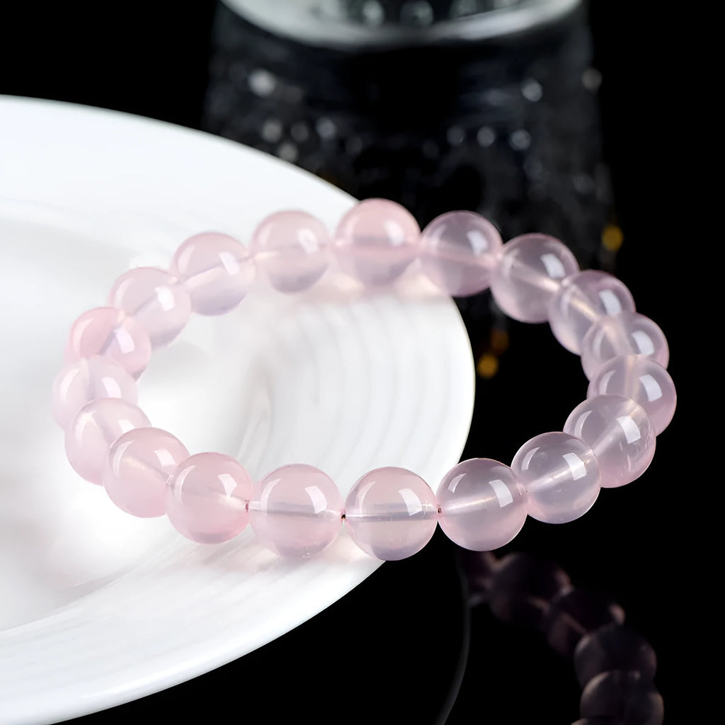Natural crystal round bead women's bracelet with polished finish in pink colour grades