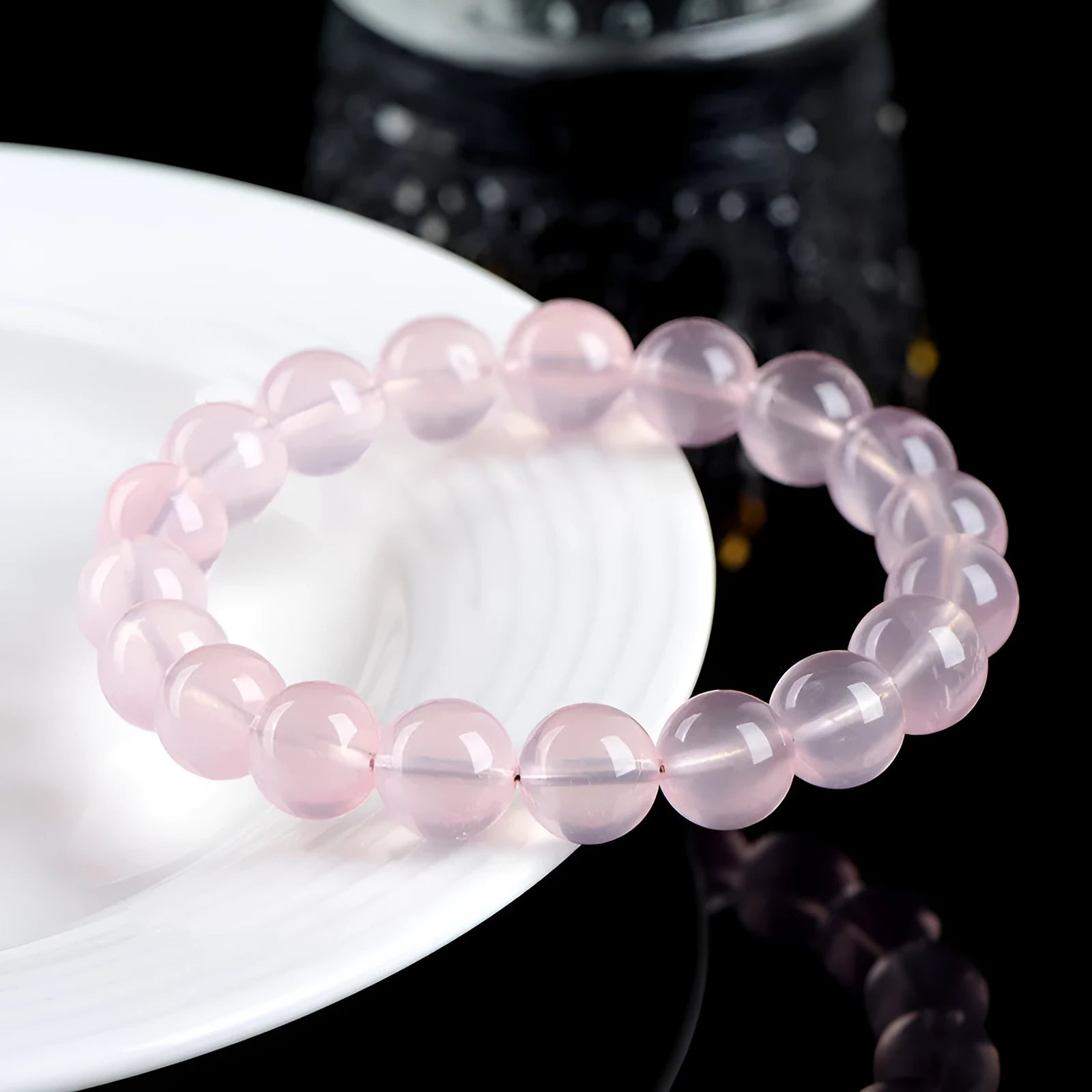 Natural crystal round bead women's bracelet with polished finish in pink colour grades