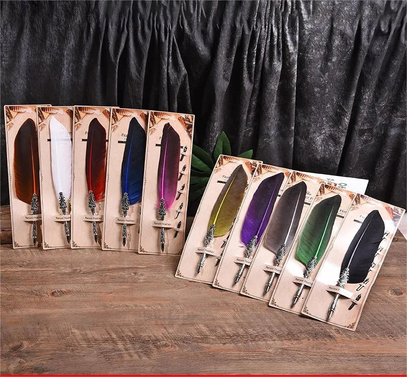 Vintage feather dip pen with zinc alloy body in ten colour options on cardboard packaging.