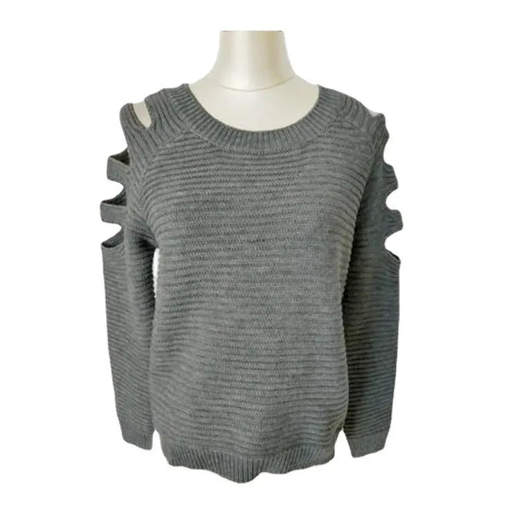 Women's white hollow-out crocheted knit shirt with round neck and long sleeves laid flat.