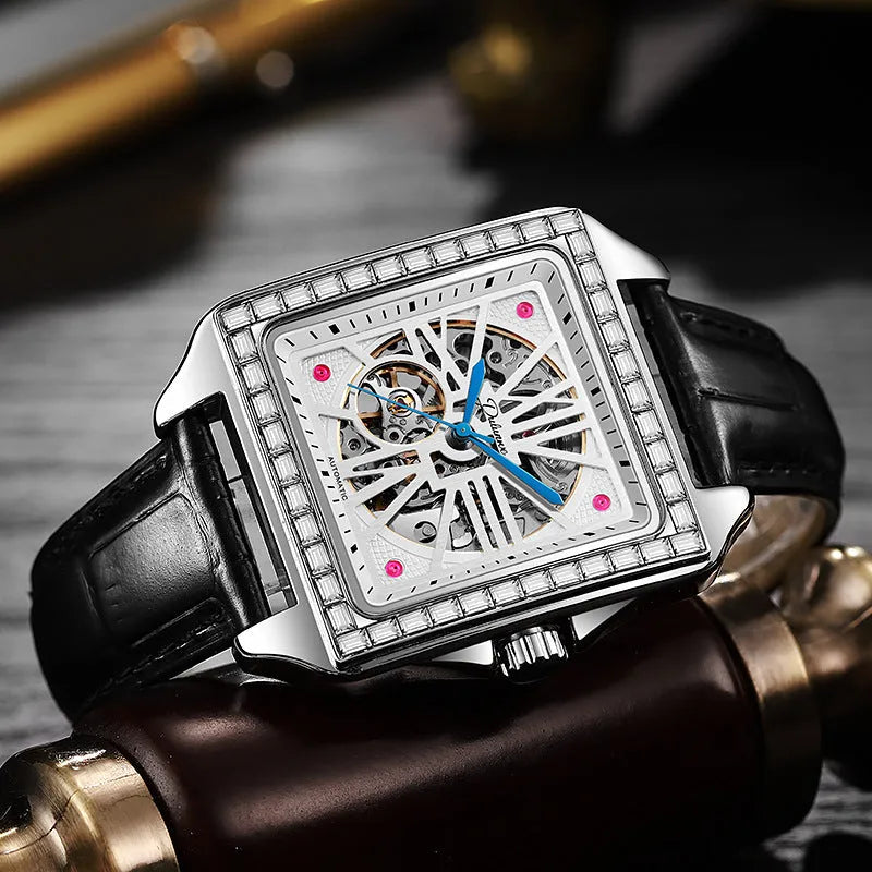 Men's square automatic watch with diamond-studded dial on a black leather strap.