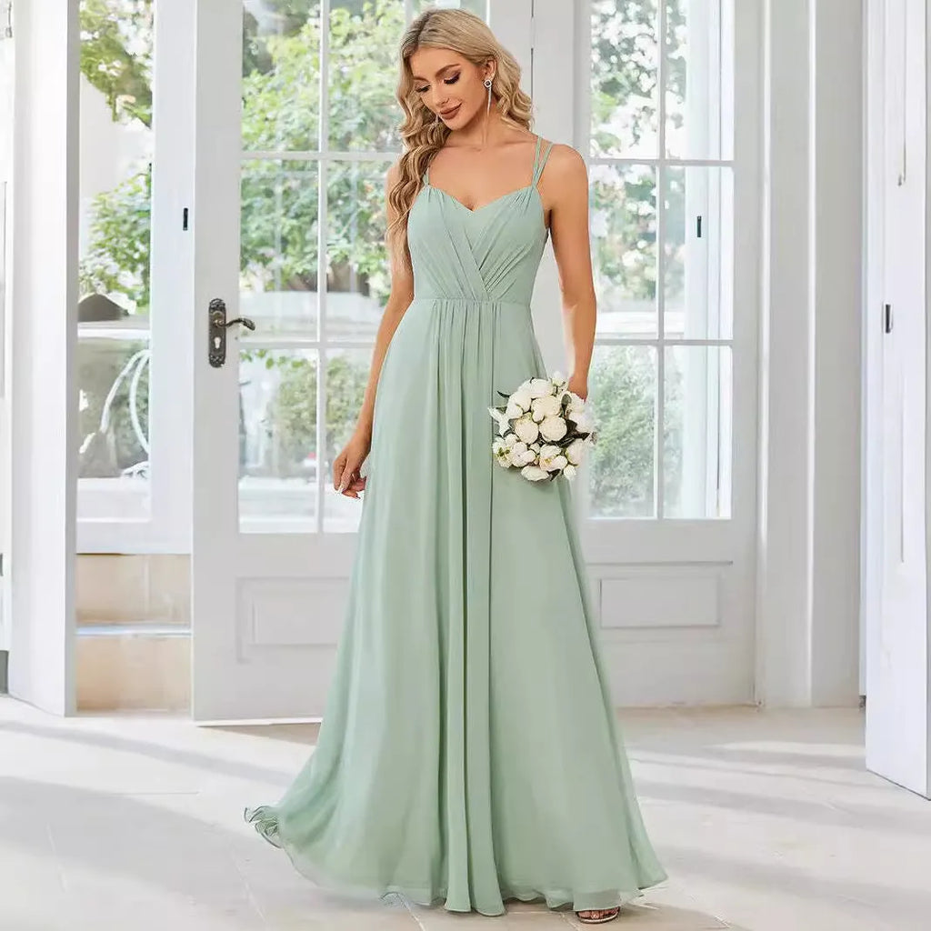 Women's sleeveless A-line long pleated dress in light green polyester fabric.