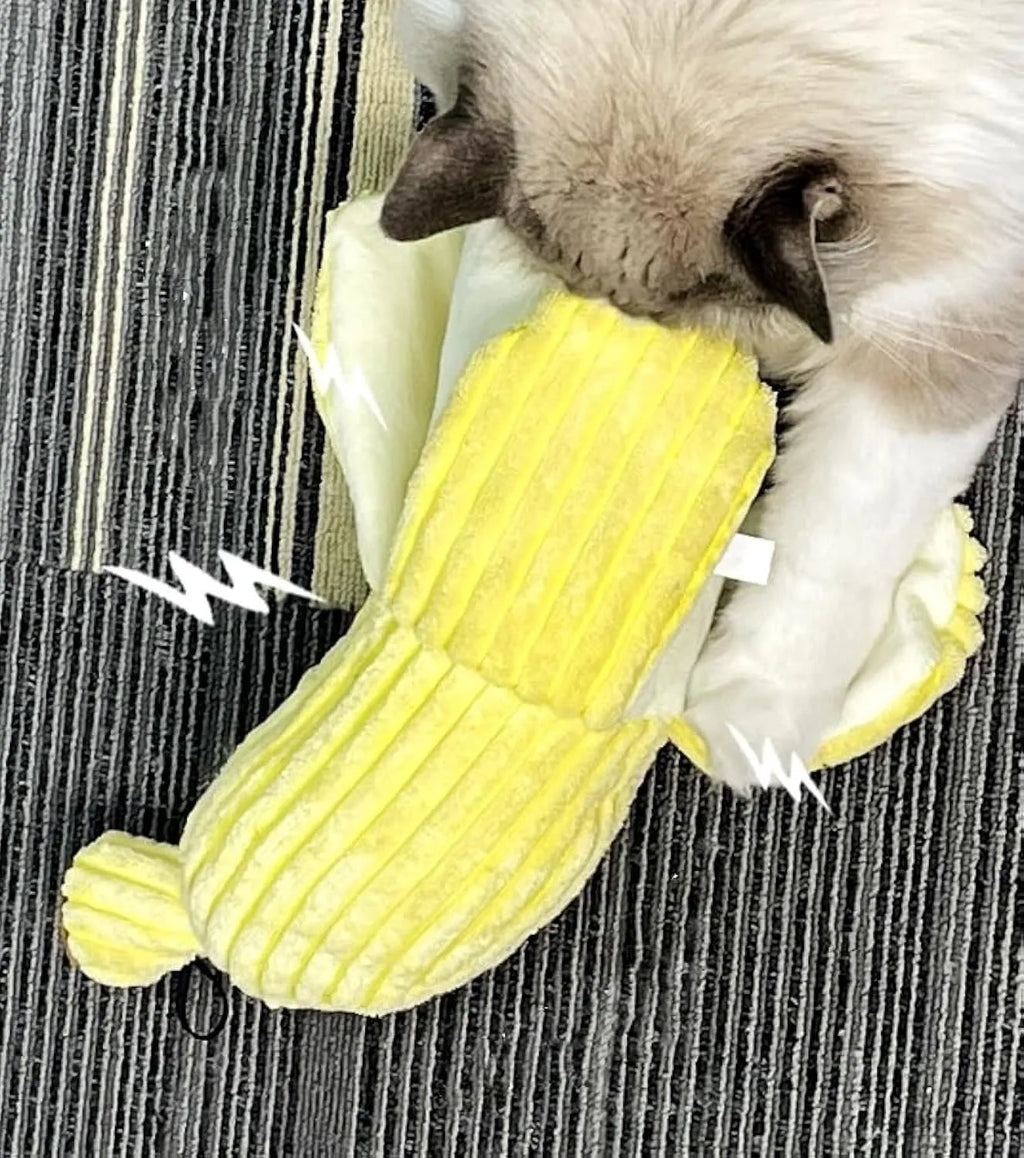 Yellow banana-shaped cat crinkle toy with plush fabric on a plain background.