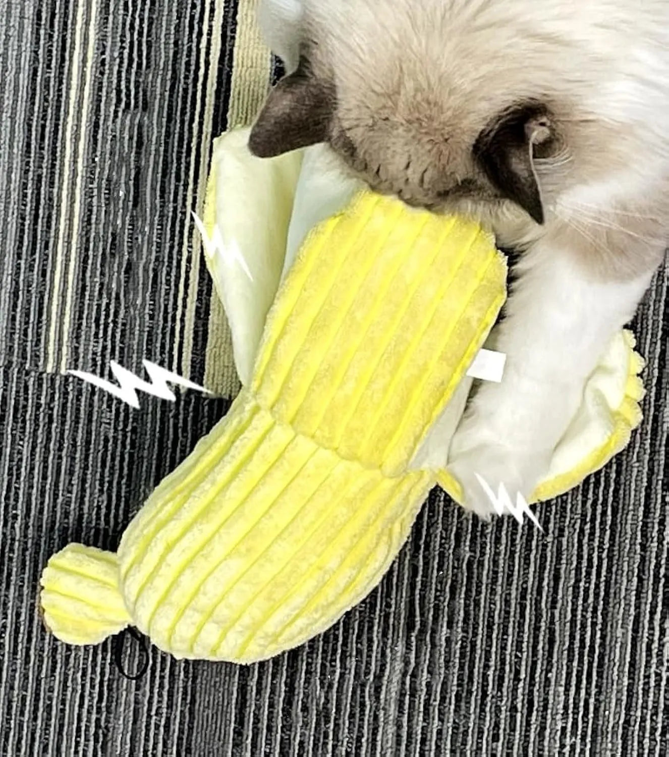 Yellow banana-shaped cat crinkle toy with plush fabric on a plain background.
