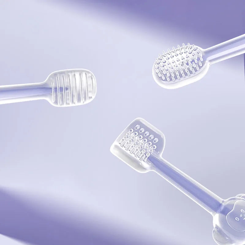 Soft silicone pet toothbrush for dogs and cats in purple, blue, and green colours with ergonomic handle.