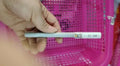 Black gel pen with full needle tube design on white surface, plastic body, cap on