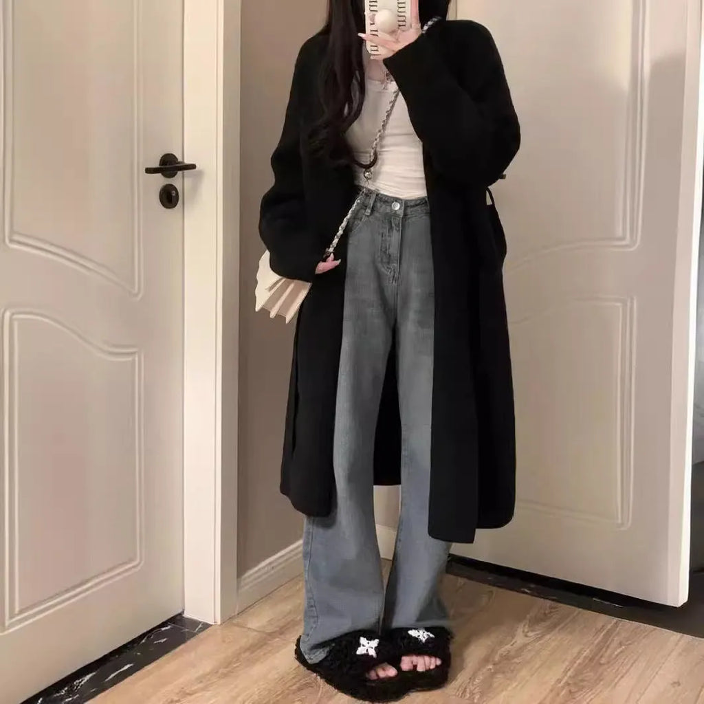Women's loose-fit mid-length knitted cardigan in grey, showing V-neck and long sleeves.
