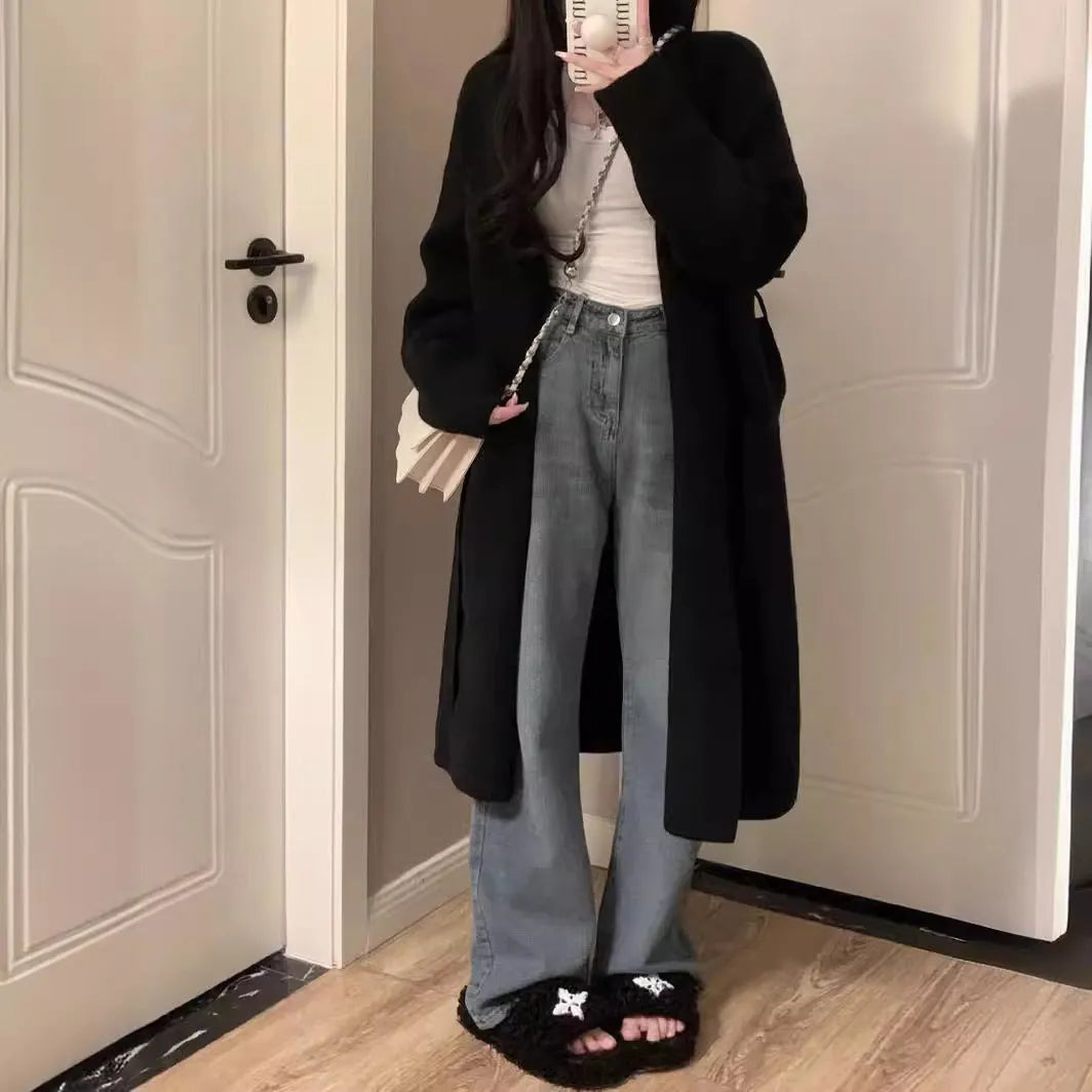 Women's loose-fit mid-length knitted cardigan in grey, showing V-neck and long sleeves.