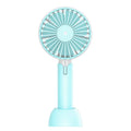 Blue mini USB electric fan with three-speed control on desk