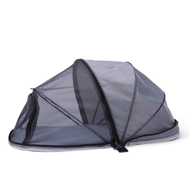 Blue half mesh folding pet tent for cats, shown in a collapsed and portable state.