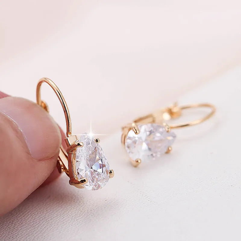 Women's drop-shaped simple metal fashion earrings in gold and platinum colour options.