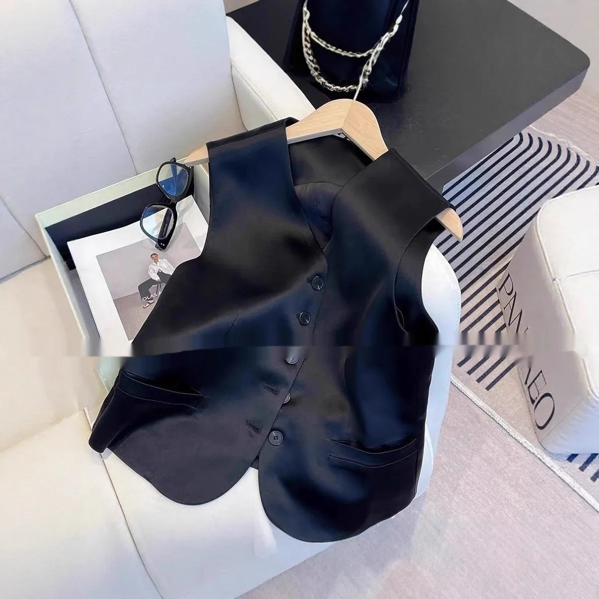 Black satin ladies' vest with sleeveless design and splicing details