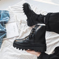 Black Dr. Martens men's platform ankle boots with side zip and fly weave pattern on frosted leather.