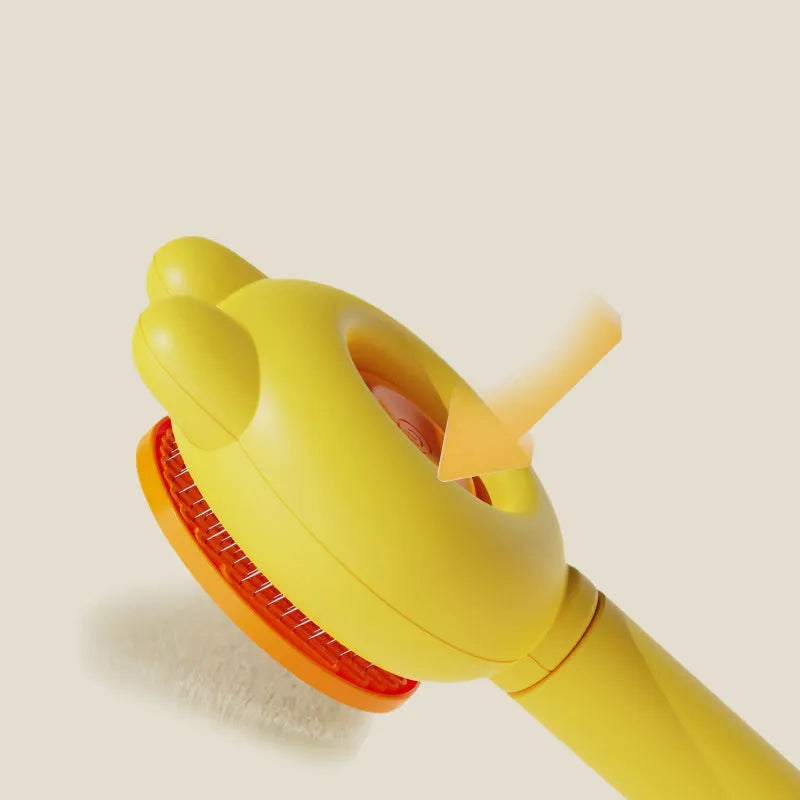 Green self-cleaning cat brush with metal comb and release button for pet grooming.