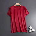 Man wearing a solid colour ice silk short sleeve crew neck T-shirt in a loose fit.