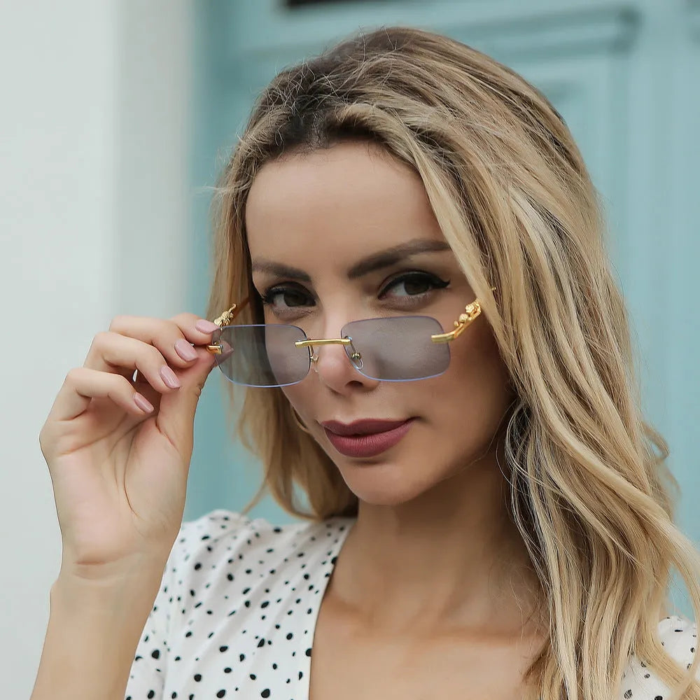 Gold metal leopard head frameless square sunglasses with pink PC lenses on a white background