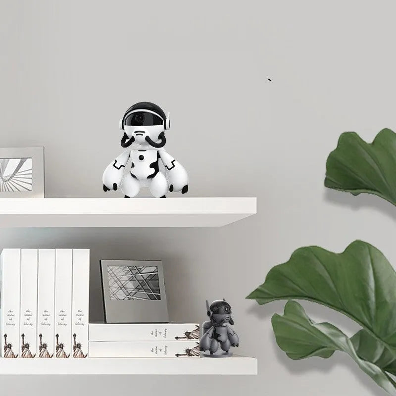 White or black Space Robot home security camera on a detachable base with anti-slip pads.
